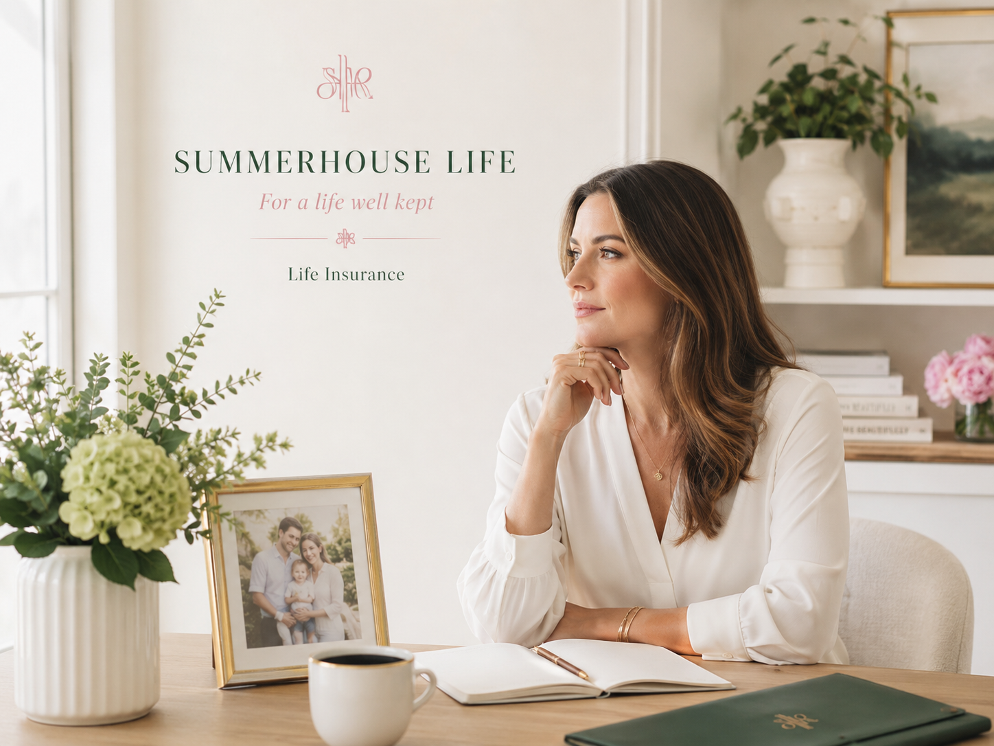 A woman at a sunlit desk with a gold-framed family photograph, green hydrangeas and an open journal, beneath the Summerhouse Life wordmark and the line For a life well kept